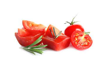 Tasty tomato ice cubes on white background