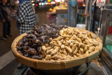 Street food, peanuts and water chestnuts steamed in wooden containers