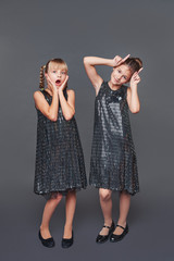 two girlfriends. portrait of girls in the studio. fashion shooting of children.