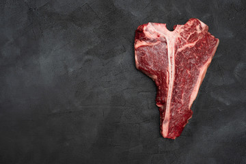 T-bone or Porterhouse on a black background. 