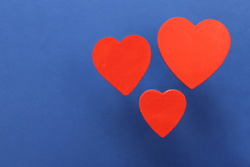 Red hearts on blue background.