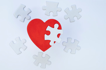 Red heart and puzzle pieces. 