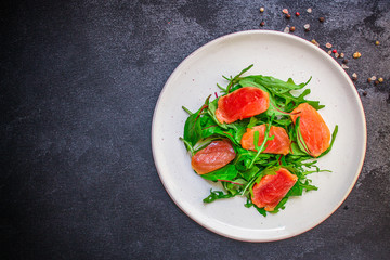 healthy salad leaves mix, salmon or tuna (delicious snack) pescatarian, keto or paleo diet menu concept. food background. top view. copy space