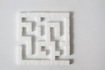 high key Detail of a maze made of sugar cubes, symbolizing unhealthy eating habits