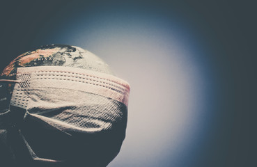 coronavirus world alert - surgical mask on globe