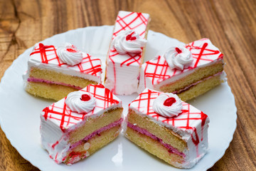 sweet,delicious cream cakes are arranged in beautiful manner.