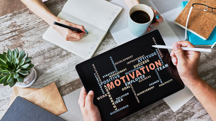 Motivation words cloud on the device screen.