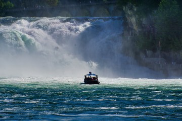 the famous rhine falls in the swiss near the city of Schaffhausen - sunny day and blue sky