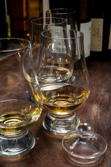 Tasting of flight of Scotch whisky from special tulip-shaped glasses on distillery in Scotland, UK