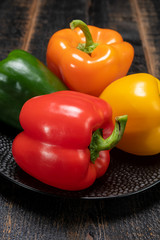 Fresh red, orange, green and yellow sweet bell paprika