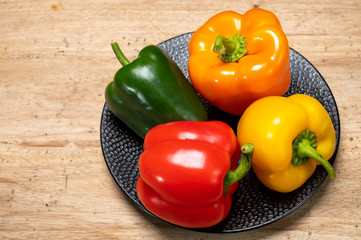 Fresh red, orange, green and yellow sweet bell paprika