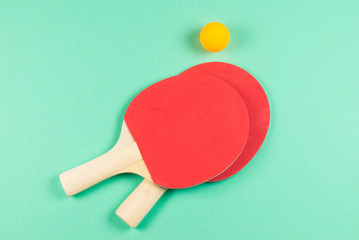 Pin pong on an green background.