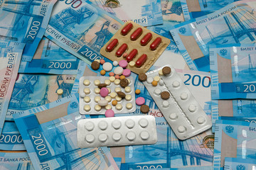 Various medicines is on the background of banknotes of the Bank of Russia