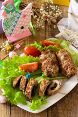 Festive appetizer. Meatloaf with prunes on the festive Easter table.