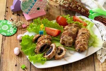 Festive appetizer. Meatloaf with prunes on the festive Easter table.
