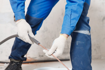 Worker man Installation of pipe channel for connecting air conditioner
