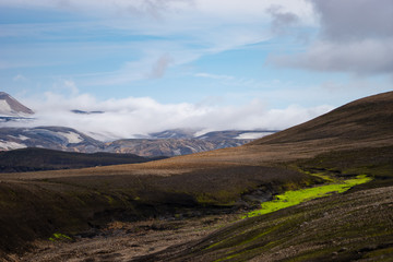 Beautiful landscape with glacier, hills and moss on the Fimmvorduhals trail near Landmannalaugar of summer sunny day, Iceland