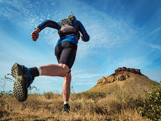 Athlete running in the desert wilderness. Butakov Bay Area in the northern part of the Small Aral...
