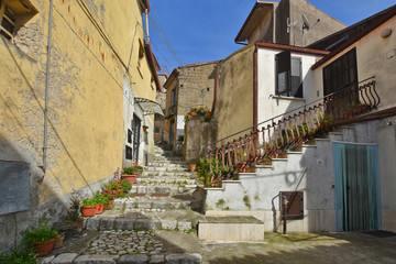 Montesarchio, Italy, 02/29/2020. A narrow street between the old houses of a medieval village.