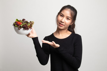 Healthy Asian woman with salad.