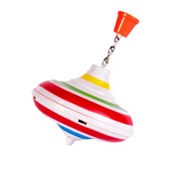 Multicolored plastic spinning top or whirligig top is traditional toy for preschool childs.Boys and...