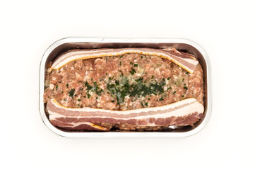 Meatloaf ready to bake in its aluminum tray