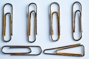 Rusty Paper clips on white acrylic background, Close up & Macro shot, Business, Education,...