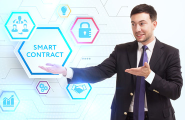 Business, Technology, Internet and network concept. Young businessman working on a virtual screen of the future and sees the inscription: Smart contract