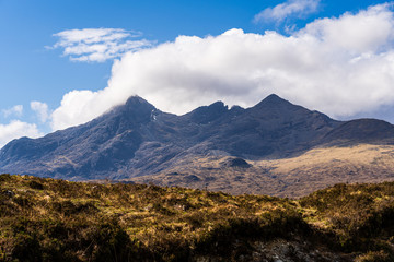 The Isle of Skye, connected to Scotland's north-west coast by a bridge, is characterised by its rugged landscape. This photo shows panoramic view on a funnel-shaped mountain.