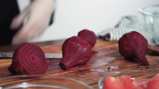 Step by step. Slicing beetroot into the small cubes for beet soup, borscht.