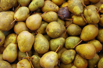Organic speckled rustic pears closeup background
