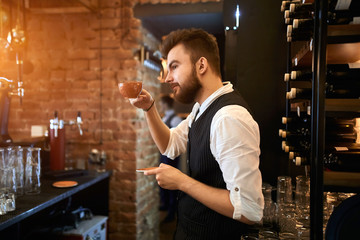 young talented barista presenting making coffee process for people, education, master class, workout. close up side view photo