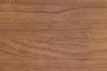 The wood surface is light brown. Background or screen saver. Textural lines of light and dark color.