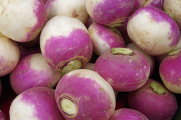 Plie of purple and white turnips trimmed and cleaned