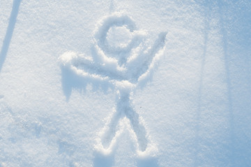 A stick figure man casually painted in the snow