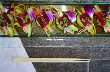 A plate of blue mango tuna sushi roll at a Japanese restaurant