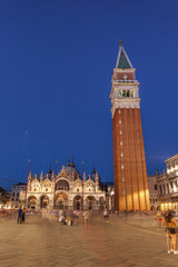 Fototapeta premium Bell tower and historical buildings at Piazza San Marco at night in Venice