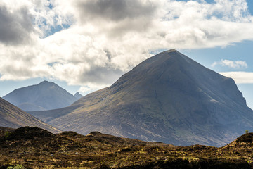 Green mountains of Quiraing, on the Isle of Skye, in the evening light of setting sun