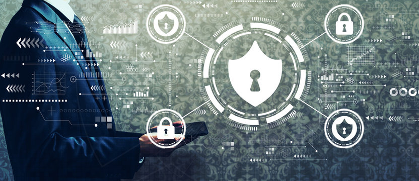 Cyber security theme with businessman holding a tablet computer