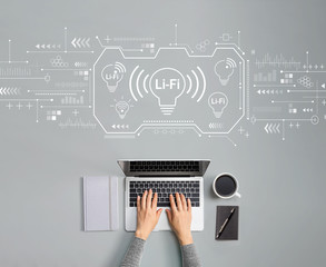 Obraz na płótnie Canvas LiFi theme with person using a laptop