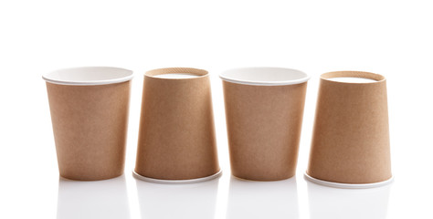 four eco paper cups isolated on white background