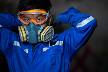 Closeup portrait of a male scientist in a gas mask 