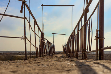 Village bridge over the river. Middle Asia. Kazakhstan. Arys River. bad road. crooked bridge....