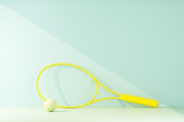 tennis racket with ball lit by a ray of light