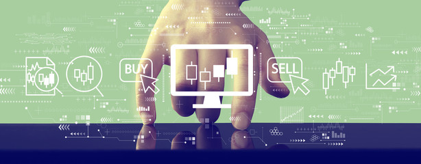 Stock trading theme with hand pressing a screen of a tablet computer