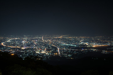 Night city scape at top view point of Chiang Mai, Thailand.