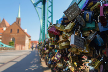 Obraz premium Ancient bridge with love colorful locks decoration