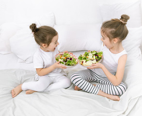 Obraz na płótnie Canvas Healthy food, children eat fruits and vegetables.