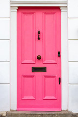 Stylish pink wooden front door