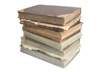 Stack of old vintage books reflecting on a white surface